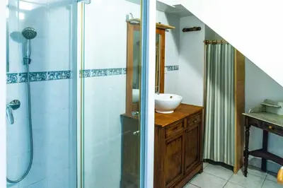 a bathroom with a sink and a shower at GITE AUTOMNE in Le Soulié