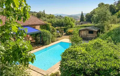 an overhead view of a swimming pool in a garden at 2 Bedroom Awesome Home In Berlou in Berlou
