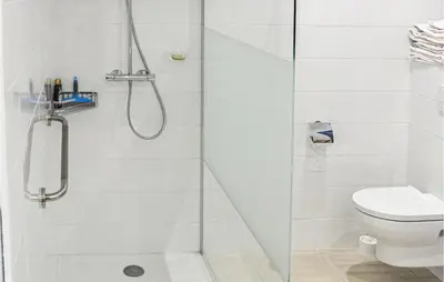 a bathroom with a shower and a toilet at 2 Bedroom Awesome Home In Berlou in Berlou