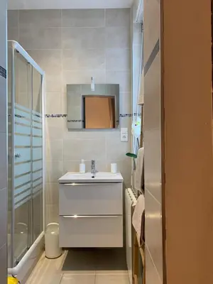 a bathroom with a sink and a mirror at La Kloé in Narbonne
