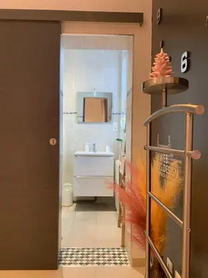 a bathroom with a sink and a mirror at La Kloé in Narbonne