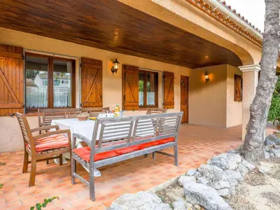 a patio with a table and chairs on a patio at Holiday Home La Maison d'Antoine by Interhome in Salles-d'Aude