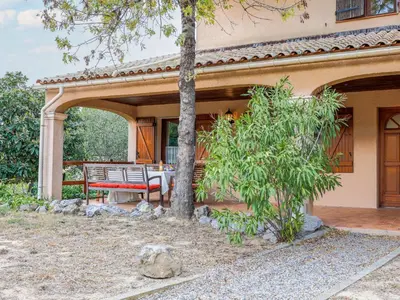 a patio of a house with a table and a tree at Holiday Home La Maison d'Antoine by Interhome in Salles-d'Aude