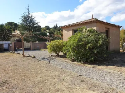a house with a gravel driveway next to a building at Holiday Home La Maison d'Antoine by Interhome in Salles-d'Aude