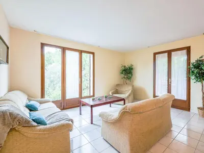 a living room with two couches and a table at Holiday Home La Maison d'Antoine by Interhome in Salles-d'Aude