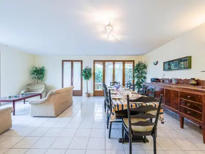 a dining room with a table and chairs at Holiday Home La Maison d'Antoine by Interhome in Salles-d'Aude