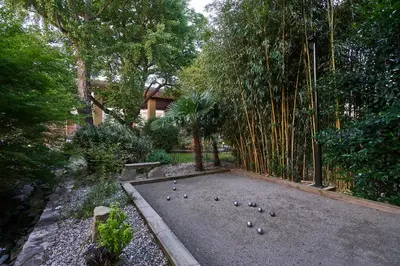 a garden with a bunch of balls on the ground at Domaine du Fresquel in Pezens