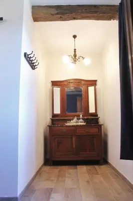 a bathroom with a sink and a mirror at Domaine de la Couderquié in Lautrec