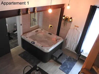 a large bath tub in a bathroom with at Love room 