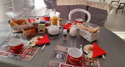 a table with food and baskets of food on it at Chez Carole et Michel en Minervois in Rieux-Minervois
