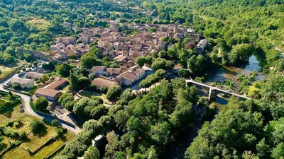 an aerial view of a village with a river and trees at MAISON ALETEIA*** DECOUVERTE ET SERENITE in Alet-les-Bains