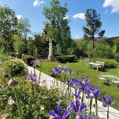 a garden with a monument on the side of a road at Résidence Espéraza ADULTS ONLY in Espéraza