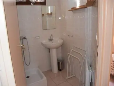 a bathroom with a sink and a shower and a toilet at Vineyards & Village Stay in Minerve