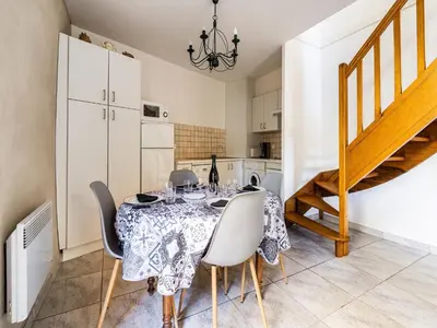 a kitchen and dining room with a table and chairs at Vineyards & Village Stay in Minerve