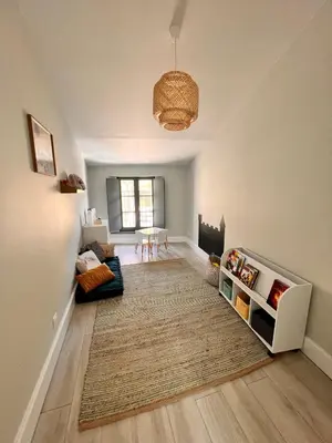 a living room with a couch and a table at Dans ma Bulle - Les Balcons de la Cité in Carcassonne