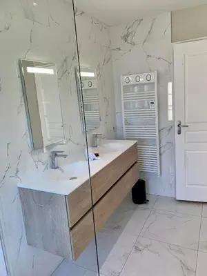 a bathroom with a sink and a mirror at Dans ma Bulle - Les Balcons de la Cité in Carcassonne