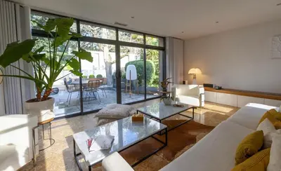 a living room with a couch and a table at House Avenue in Carcassonne