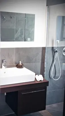 a bathroom with a sink and a shower at House Avenue in Carcassonne