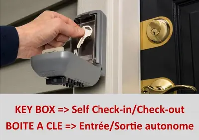 a person unlocking a door with a key box securely at Au Canal du Midi - Appartements au cœur de la ville in Carcassonne