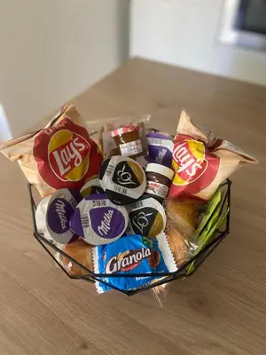 a basket full of chips and snacks on a table at ** Superbe appartement sur le canal du midi ** in La Redorte