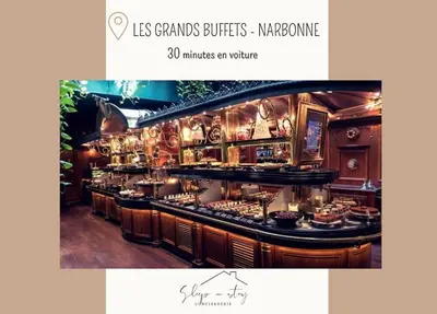 a restaurant with a counter with food on it at ** Superbe appartement sur le canal du midi ** in La Redorte