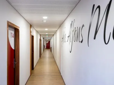 a corridor of an office building with a hallway at CIS Lamourelle Centre International de Sejour in Carcassonne