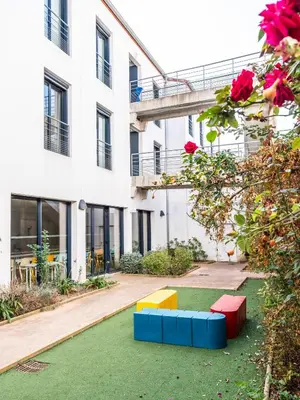 a playground in the courtyard of a building at CIS Lamourelle Centre International de Sejour in Carcassonne