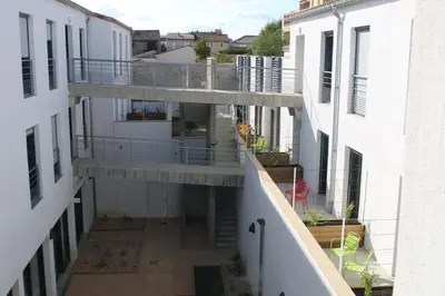 an aerial view of a building with two balconies at CIS Lamourelle Centre International de Sejour in Carcassonne
