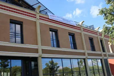 an exterior view of a building with windows at CIS Lamourelle Centre International de Sejour in Carcassonne