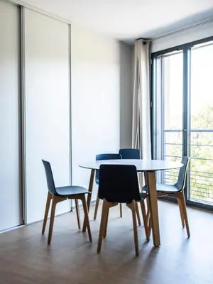 a dining room with a table and chairs at CIS Lamourelle Centre International de Sejour in Carcassonne