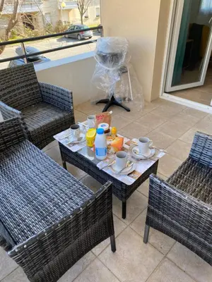 a table with a tray of food and drinks on it at Best cocooning au calme avec parking privé in Carcassonne