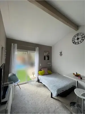a bedroom with a bed and a window at Studio RIQUET indépendant attenant à Villa in Capestang