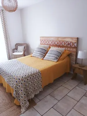 a living room with a couch and a coffee table at Le Logis du Moulin Gîte avec Jacuzzi, à 800m de la Cité Médiévale in Carcassonne