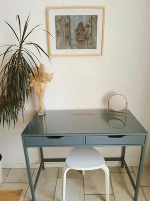 a wooden console table with a picture on top of it at Le Logis du Moulin Gîte avec Jacuzzi, à 800m de la Cité Médiévale in Carcassonne