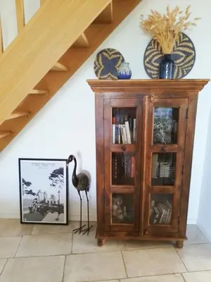 a living room with a wooden table and chairs at Le Logis du Moulin Gîte avec Jacuzzi, à 800m de la Cité Médiévale in Carcassonne