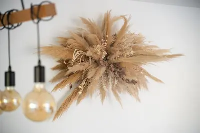 a flower hanging from a wall with two lights at Maison de campagne 6 pers salle de jeux & pétanque in Cuq