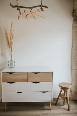a white dresser in a room with a stool at Maison de campagne 6 pers salle de jeux & pétanque in Cuq