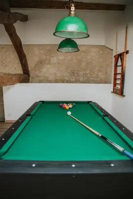 a green pool table with balls on top of it at Maison de campagne 6 pers salle de jeux & pétanque in Cuq