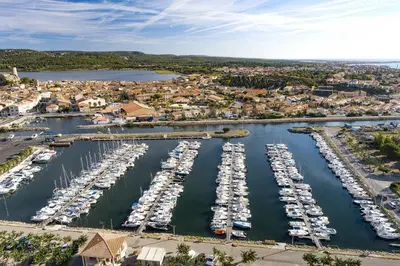 an aerial view of a marina with boats in the water at Mobil Home XXL 4 chambres - Camping Le Barberousse in Gruissan