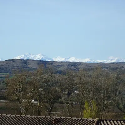 a view of snow covered mountains from a house at L'oustal des Fontanilles in Castelnaudary