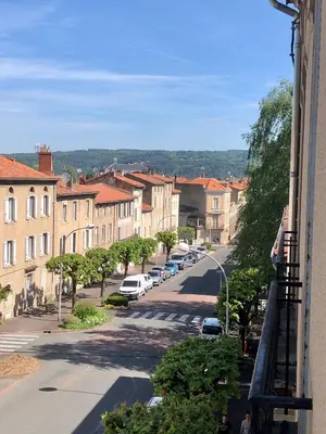 a view of a city street with cars parked at La Grande Maison Mazamet in Mazamet