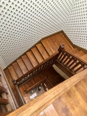 an overhead view of a wooden staircase in a room at La Grande Maison Mazamet in Mazamet