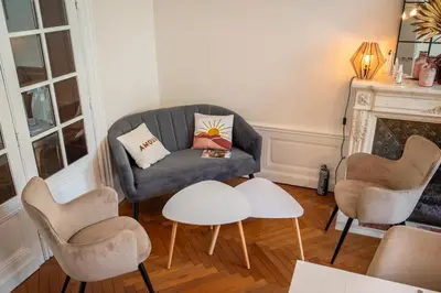 a living room with a couch and chairs and a table at La Grande Maison Mazamet in Mazamet