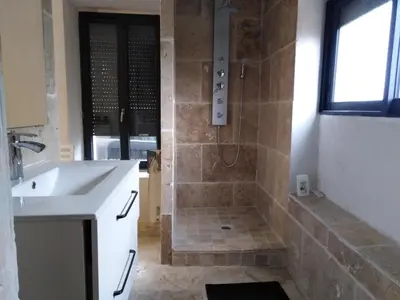 a bathroom with a shower and a sink at maison a bizanet avec piscine in Bizanet