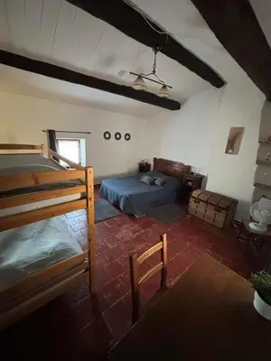 a bedroom with a bed in a room at Chez Nath et Oli in Caunes-Minervois