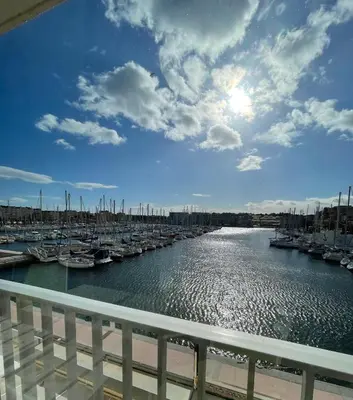 a view of a marina with boats in the water at Idéal couple avec vue sur le PORT DE GRUISSAN 4CHE24 in Gruissan