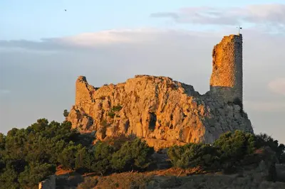 a church sits on top of a mountain at Idéal couple avec vue sur le PORT DE GRUISSAN 4CHE24 in Gruissan