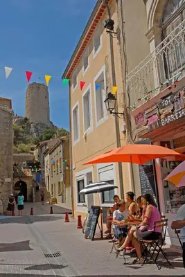 a group of people sitting at a table under an umbrella at Idéal couple avec vue sur le PORT DE GRUISSAN 4CHE24 in Gruissan