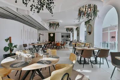 a dining room with tables and chairs at Le Meez in Carcassonne