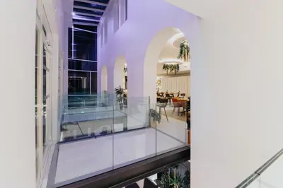 an external view of a building with a glass balcony at Le Meez in Carcassonne